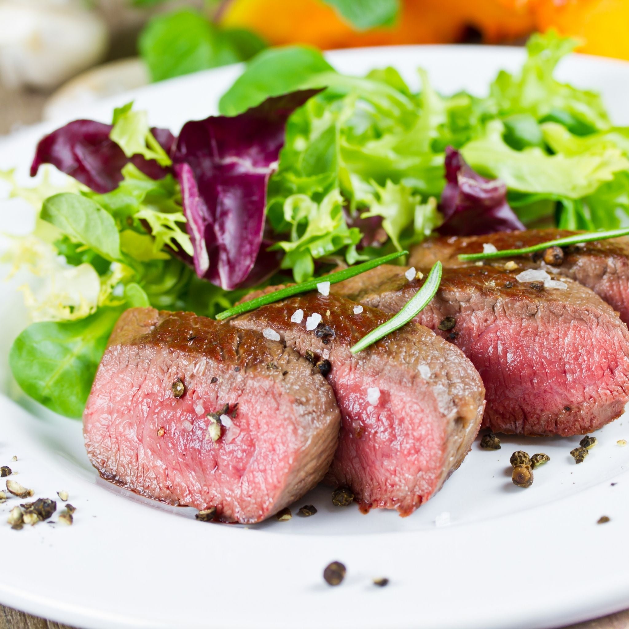 beef-porterhouse-steak-medium-rare-pasture-fed-locally-sourced-pasture-fed-rosemary-garnish-rocket-lettuce.jpg